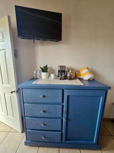 a blue dresser in a room with a counter top at Tayau Bungalows B6 in Lo de Marcos