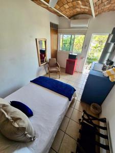 a bedroom with a large bed in a room at Tayau Bungalows B6 in Lo de Marcos