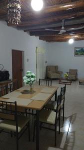 a dining room with a table and some chairs at Casa Langla Lunahuana in Lunahuaná