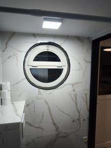 a bathroom with a toaster oven on a wall at Modern lux studio B in Beringen