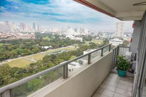 a balcony with a view of the city at Eton Baypark Manila Bay in Manila