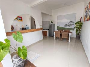 a kitchen and dining room with a table and chairs at Ariani Villa in Jimbaran