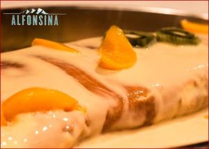 a piece of food with an egg on a plate at Hotel La Alfonsina in Santibáñez de Villacarriedo