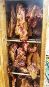 a drawer full of chicken and other meats and poultry at Casa de Vacanta Neagu in Gura Teghii