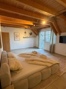 a large bed in the middle of a room at Aparthotel Casa Vasco - by Willms & Schömer eG in Euskirchen