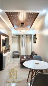a living room with a couch and a table at Sophisticated 1BR Unit w Panoramic Horizon View in Cebu City