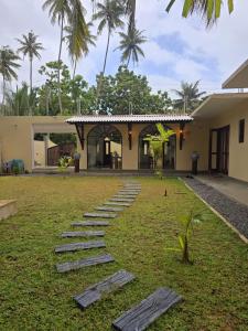 a row of stepping stones in front of a house at The Arch View in Habaraduwa Central