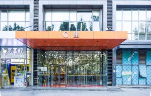 an entrance to a building with an orange roof at Anju Apartment in Beijing