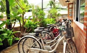 a group of bikes parked next to a building at My Chiangmai Boutique Lodge in Chiang Mai