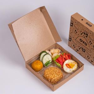a box filled with different types of food at Dancenter The Ethnic Hotel in Bandung