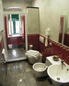 a bathroom with a toilet and a sink at Camere D'Autore La Poesia in Monterosso al Mare