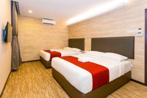 Postel nebo postele na pokoji v ubytování Icon Hotel Segamat