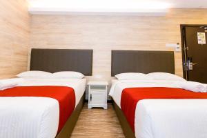 Postel nebo postele na pokoji v ubytování Icon Hotel Segamat
