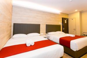 Postel nebo postele na pokoji v ubytování Icon Hotel Segamat