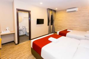 Postel nebo postele na pokoji v ubytování Icon Hotel Segamat
