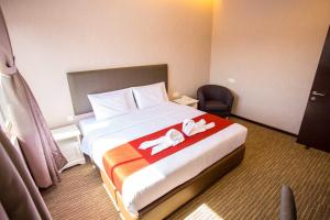 Postel nebo postele na pokoji v ubytování Icon Hotel Segamat