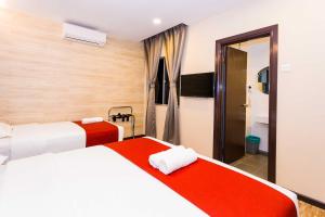 Postel nebo postele na pokoji v ubytování Icon Hotel Segamat