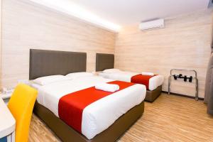 Postel nebo postele na pokoji v ubytování Icon Hotel Segamat