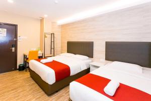 Postel nebo postele na pokoji v ubytování Icon Hotel Segamat