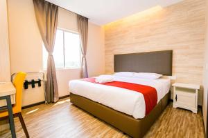 Postel nebo postele na pokoji v ubytování Icon Hotel Segamat