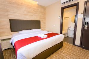 Postel nebo postele na pokoji v ubytování Icon Hotel Segamat