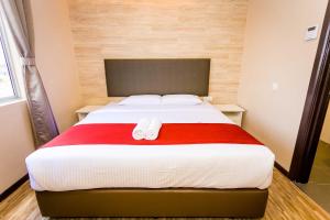 Postel nebo postele na pokoji v ubytování Icon Hotel Segamat