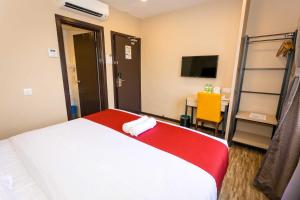 Postel nebo postele na pokoji v ubytování Icon Hotel Segamat