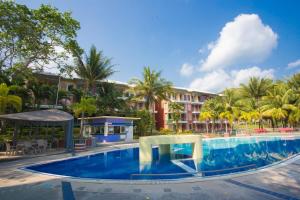 a large swimming pool in front of a hotel at Brookside Valley Resort in Rayong