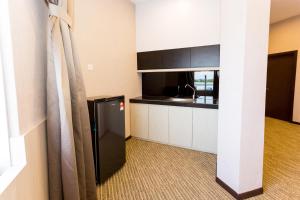 Kuchyň nebo kuchyňský kout v ubytování Icon Hotel Segamat
