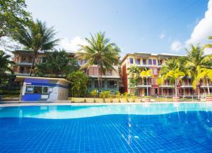 a swimming pool in front of a resort at Brookside Valley Resort in Rayong