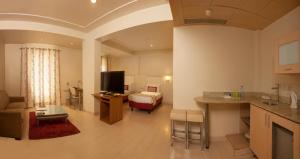 Kuchyň nebo kuchyňský kout v ubytování Avalon Courtyard Residence Suites