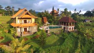 an aerial view of a house with a swimming pool at The Kanjeng Signature Sidemen in Sidemen