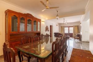 a dining room with a table and chairs at Orma in Cochin