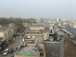 an overhead view of a city with cars and buildings at The Pearl Petal in Rohtak