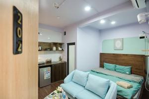 a small room with a bed and a couch at Trên Mây HST - 91 Cầu Diễn in Văn Trì +104 photos
