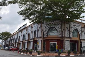 a building on the side of a street at Hotel Desaru Penawar in Desaru