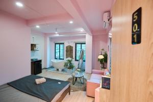 a room with a bed and a bath tub in it at Trên Mây HST - 91 Cầu Diễn in Văn Trì
