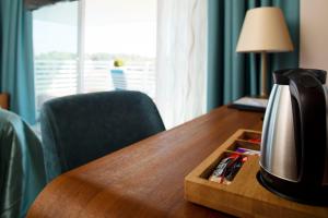 Příslušenství pro přípravu čaje a kávy v ubytování Hotel Navis