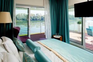 Postel nebo postele na pokoji v ubytování Hotel Navis