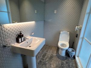 a bathroom with a sink and a toilet at 하늘정원 in Gwangju