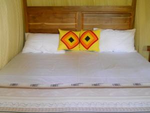 Lova arba lovos apgyvendinimo įstaigoje Sunset Tourist Home