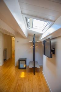 a living room with a skylight and a fireplace at Luxury B&B Maison Madre in the historic center of Avola in Avola