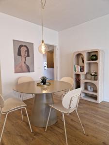 a dining room with a table and chairs at Fully equiped 100 m2 appt with the perfect location in Vilvoorde