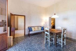 a living room with a table and a couch at Terrazza a Campana in Panzano