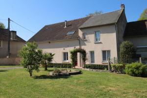 a large white house with a yard at Champblanc in Arnac-la-Poste