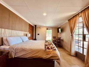 a bedroom with a large bed in a room at The Grove in Potchefstroom +195 photos