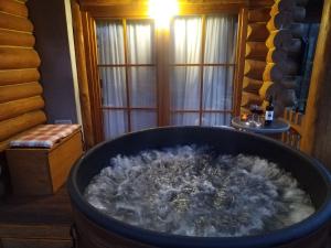 a large tub filled with water in a room at Kuća lješnjaka in Ludbreg