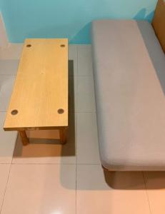 a bed and a bench in a room at อุดมสุข BTS udomsuk in Bangna +1 photo