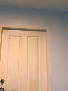 a white door in a white wall at อุดมสุข BTS udomsuk in Bangna