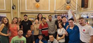 a group of people posing for a picture at Little Charm Hanoi Hostel in Hanoi